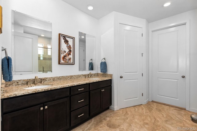 15802 Xanthia Way, Thornton, CO 80602 - bathroom featuring double vanity and an enclosed shower