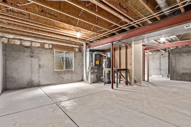 unfinished basement featuring water heater