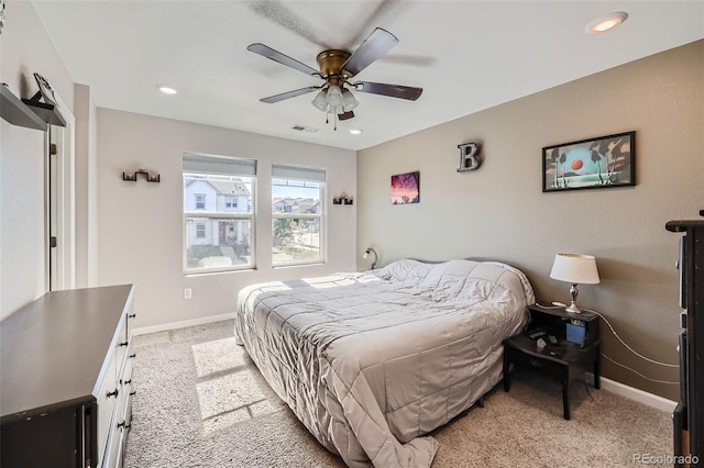 bedroom with light carpet, baseboards, recessed lighting, and ceiling fan