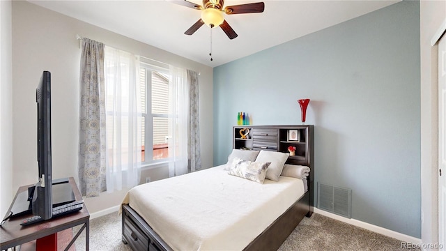 bedroom with a ceiling fan, light colored carpet, visible vents, and baseboards