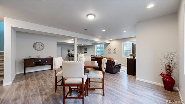 dining room with recessed lighting, visible vents, baseboards, stairway, and dark wood-style floors