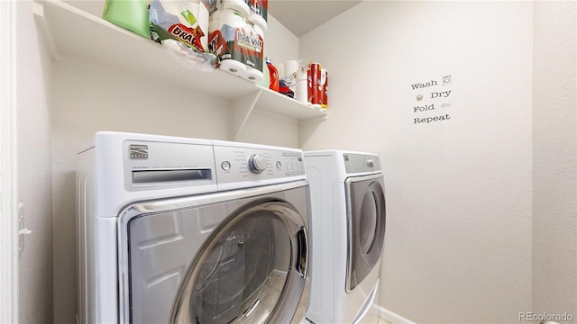 washroom with laundry area and washing machine and clothes dryer