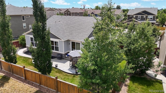 birds eye view of property with a residential view