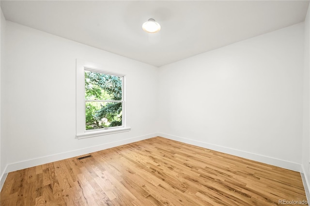 734 N Downing St, Denver, CO 80218 - unfurnished room with baseboards and light wood-style flooring