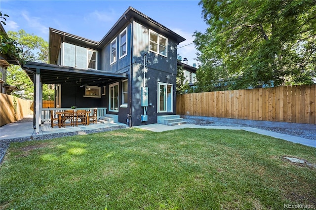 734 N Downing St, Denver, CO 80218 - back of house with entry steps, a fenced backyard, and a patio
