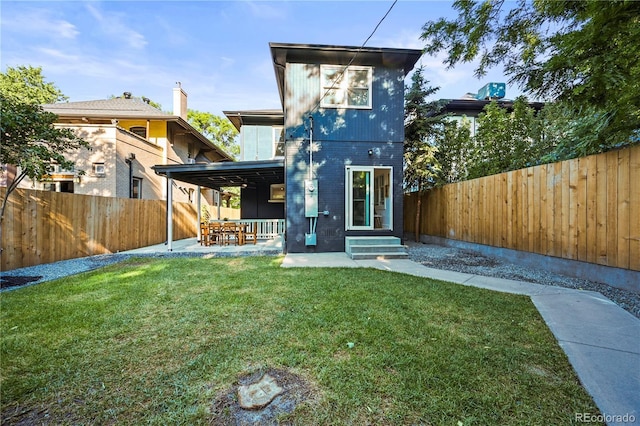 734 N Downing St, Denver, CO 80218 - back of house with a fenced backyard, a patio, and brick siding