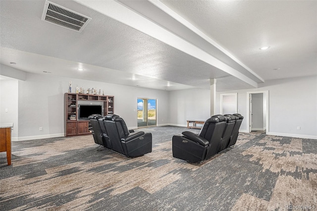 carpeted living room featuring baseboards, visible vents, and a textured ceiling