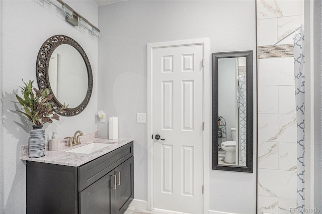 full bathroom with toilet and vanity