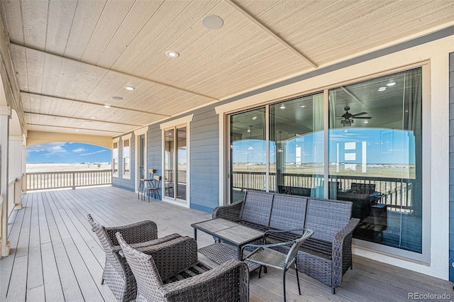 wooden deck featuring outdoor lounge area