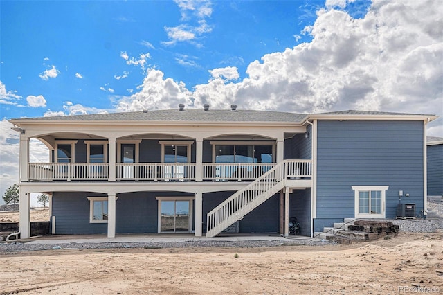 back of house with stairway and a patio area