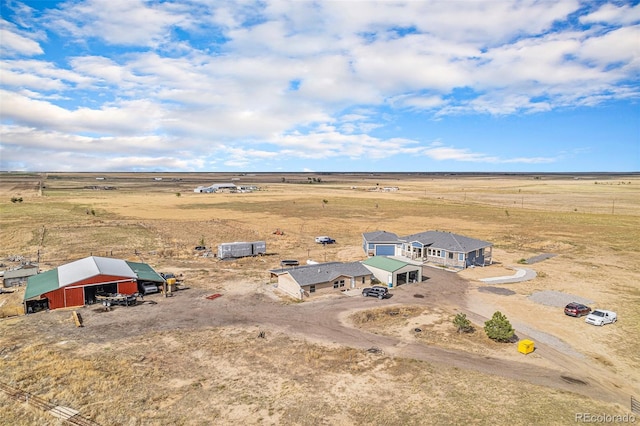 birds eye view of property with a rural view