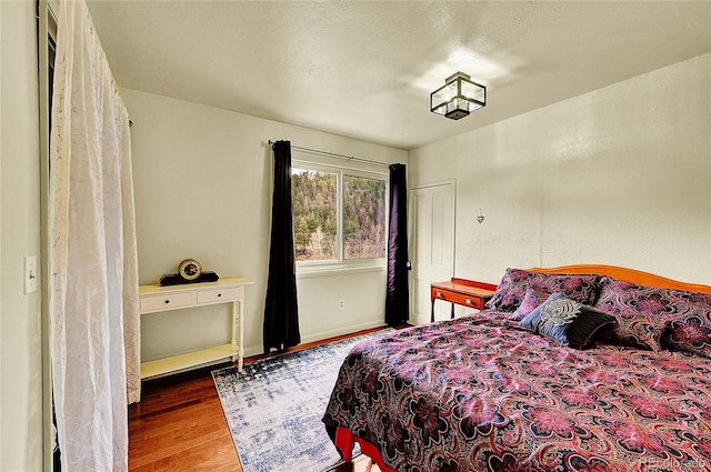 bedroom featuring wood finished floors