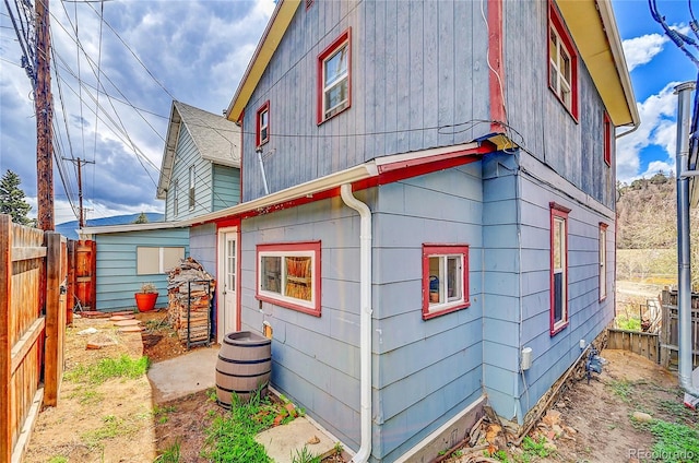 view of side of property with fence