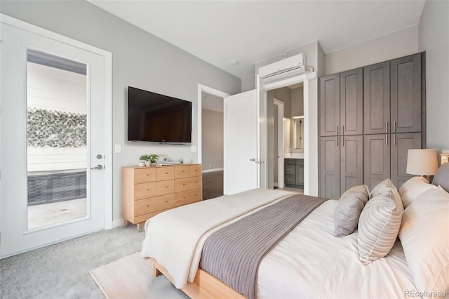 carpeted bedroom featuring access to outside and a wall mounted air conditioner