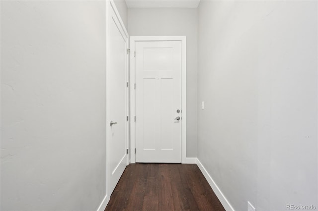 corridor featuring dark wood-type flooring