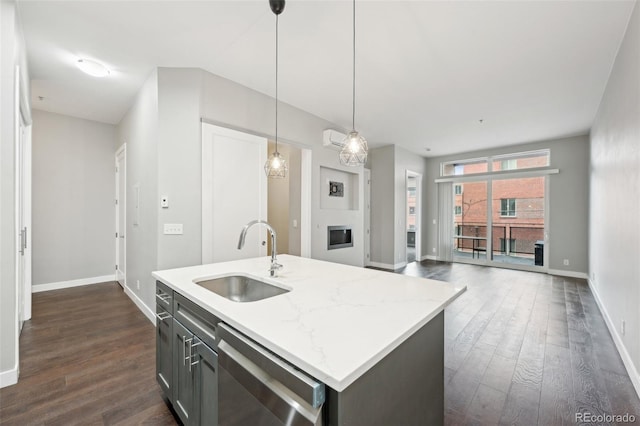 kitchen with sink, dark wood-type flooring, dishwasher, a center island with sink, and decorative light fixtures