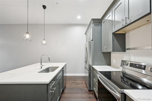 kitchen with sink, gray cabinetry, hanging light fixtures, appliances with stainless steel finishes, and light stone countertops