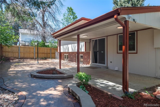 view of patio featuring fence