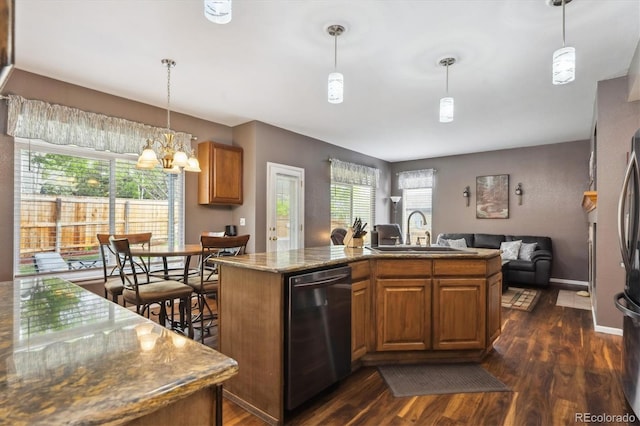 kitchen featuring a kitchen island with sink, stainless steel dishwasher, dark wood finished floors, a sink, and open floor plan