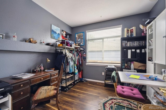 office space featuring baseboards and dark wood-style floors