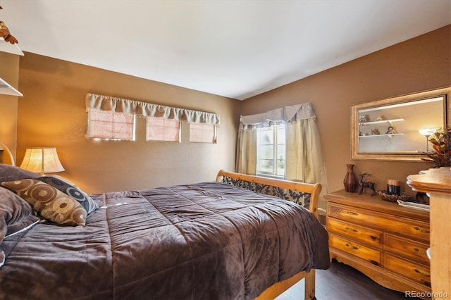 bedroom with wood finished floors