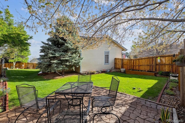 view of patio with a fenced backyard and outdoor dining area