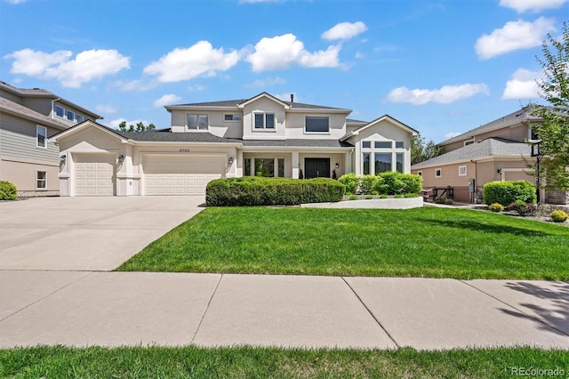 view of front of house with a garage, driveway, a front lawn, and stucco siding