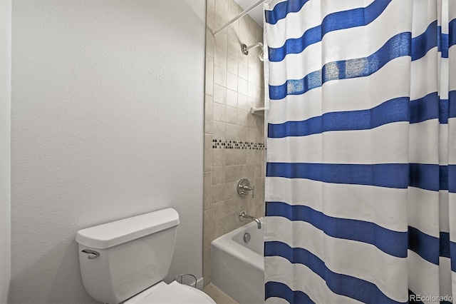 full bathroom with toilet and shower / bath combo
