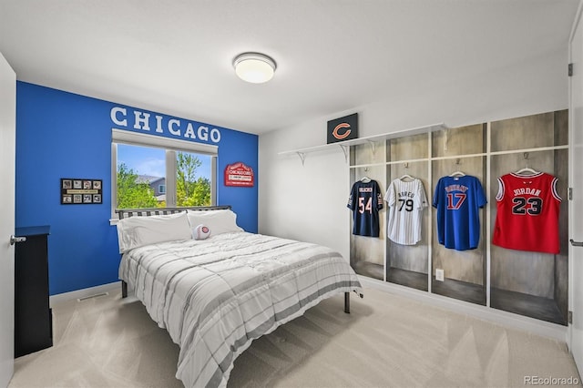 carpeted bedroom with baseboards