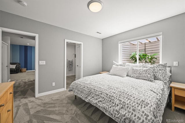 carpeted bedroom featuring baseboards