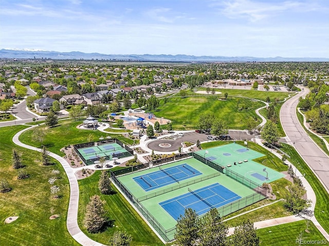 aerial perspective of suburban area with a mountainous background