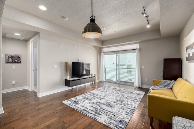 2650 Front Vw Unit 205, Denver, CO 80211 - living room with a tray ceiling, a textured ceiling, hardwood / wood-style floors, baseboards, and track lighting