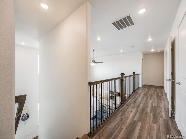 hall with hardwood / wood-style flooring