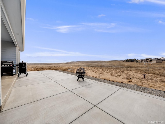 view of patio with a fire pit