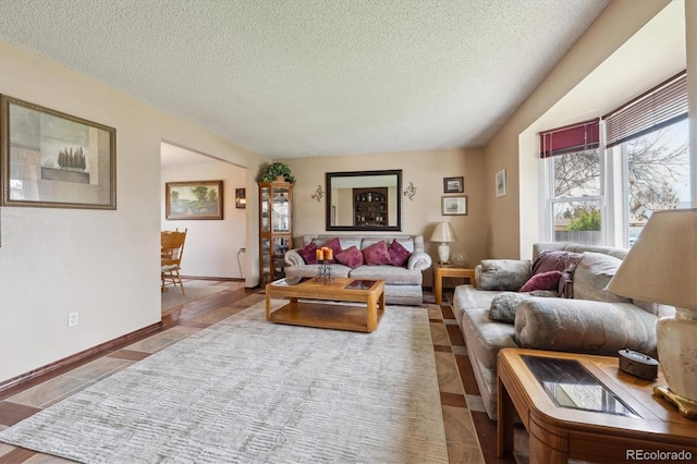 living area featuring a textured ceiling