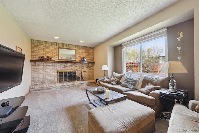 carpeted living area with recessed lighting, a brick fireplace, and a textured ceiling
