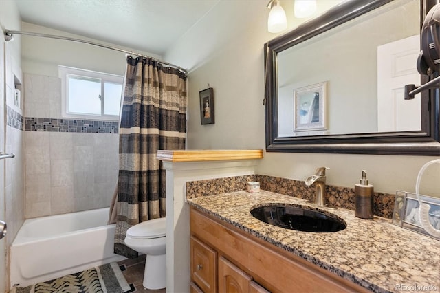 full bathroom with shower / bath combo with shower curtain, toilet, vanity, and tile patterned floors