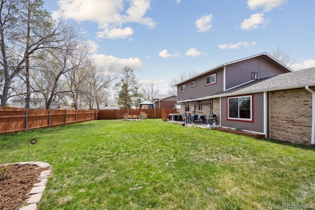 view of yard featuring a fenced backyard and a patio