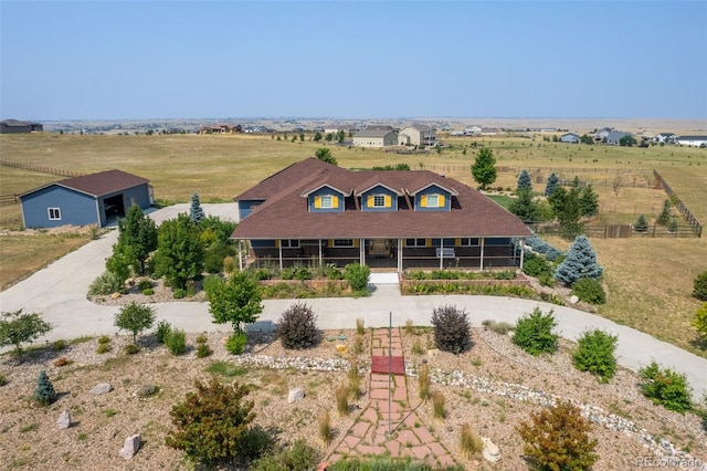 view of front of property with a rural view