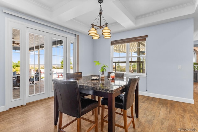 dining space with coffered ceiling, light hardwood / wood-style flooring, french doors, and beamed ceiling