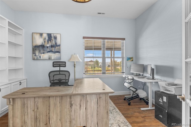 office space with dark wood-type flooring