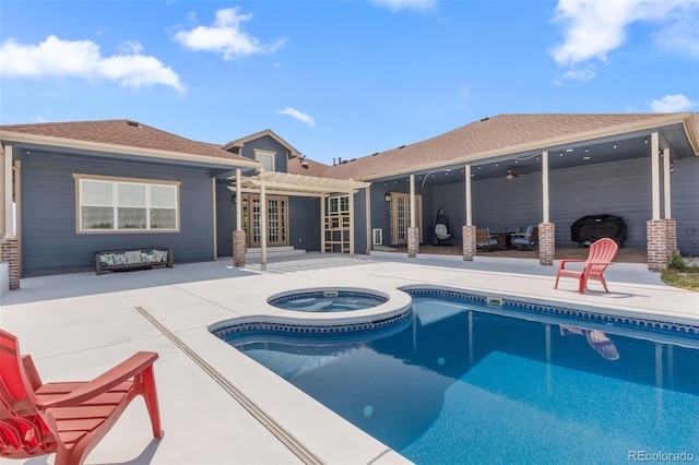 view of swimming pool with an in ground hot tub, a pergola, and a patio area