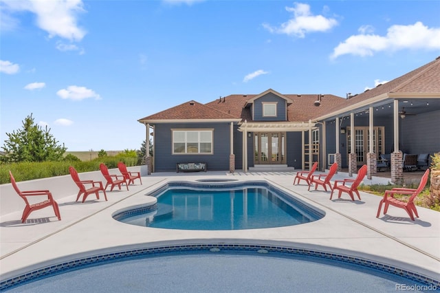 view of pool with french doors, ceiling fan, a pergola, and a patio area