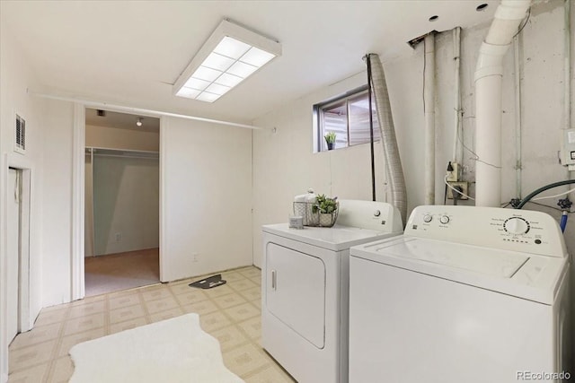 laundry area featuring independent washer and dryer