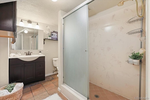 bathroom with vanity, toilet, an enclosed shower, and a textured ceiling