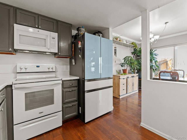 kitchen with dark wood-style flooring, crown molding, gray cabinets, light countertops, and white appliances