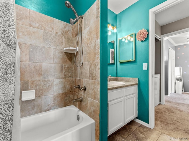 full bath featuring ornamental molding, vanity, baseboards, and shower / bathtub combination