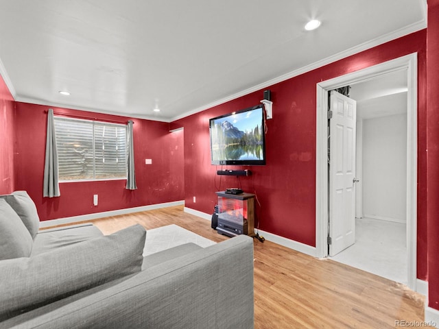 cinema room with recessed lighting, baseboards, crown molding, and wood finished floors