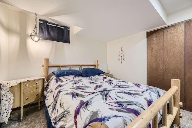 bedroom with dark colored carpet