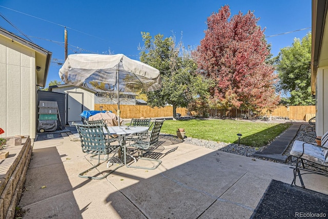 view of patio / terrace with a shed